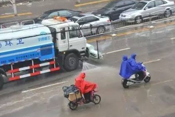 water truck cleaning the road 